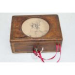 A Victorian tan leather clad box, the lid inset with a head and shoulders portrait of a lady,