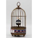 A reproduction brass and cloisonne enamel birdcage automaton clock, height 19cm