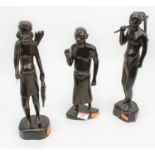 A set of three African carved hardwood figures, the largest h.31cm