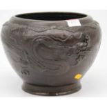 A Japanese bronze jardiniere, relief decorated with dragons, height 18cm