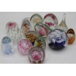 A collection of 20th century coloured glass paperweights