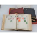 A collection of vintage world stamp albums and contents