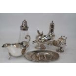 A small collection of miscellaneous silver plated items to include a sauceboat on stand,
