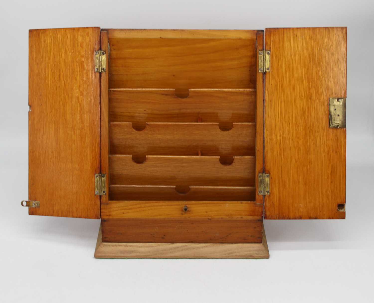 An early 20th century light oak stationery box, on a later plinth base, h.33cm