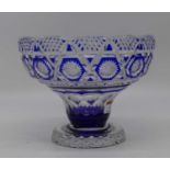 A blue overlaid crystal bowl, with star cut decoration, height 18cmSmall chip size of a ½ pence