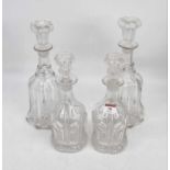 A pair of Edwardian hand blown glass decanters, each of fluted bell shape with stopper, height 30cm,