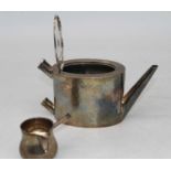 A George III silver bachelors teapot, of plain oval form, having band of bright cut engraved