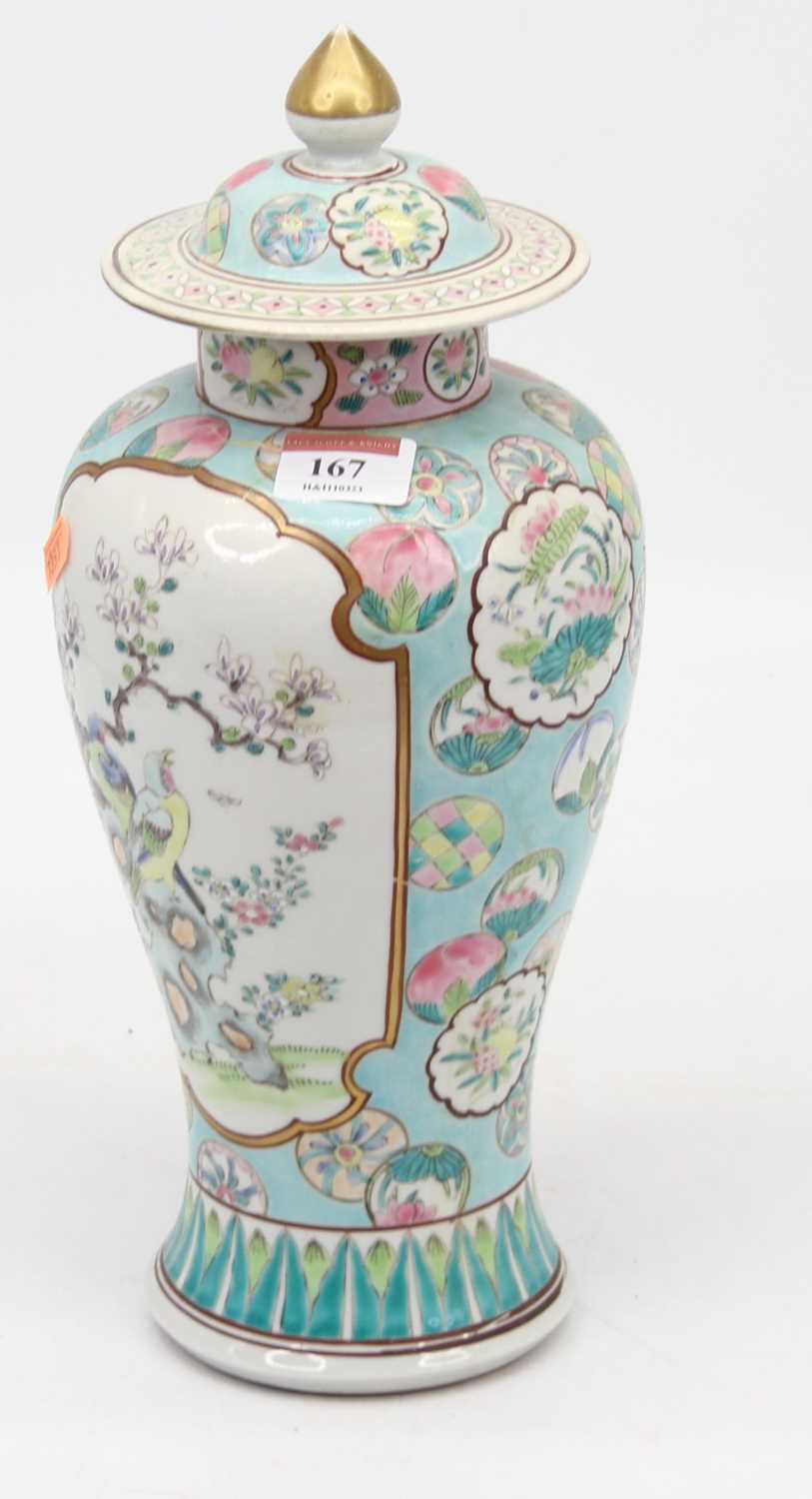 A Chinese porcelain vase and cover, enamel decorated with flowers, height 32cm