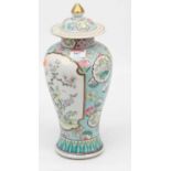 A Chinese porcelain vase and cover, enamel decorated with flowers, height 32cm