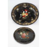A Victorian ebonised papier mache tray, decorated with flowers, mother of pearl inlay and gilt