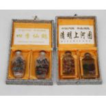 Four reproduction Chinese glass snuff bottles, cased