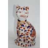 A modern Chinese pottery model of a cat, in seated pose, h.36cm