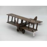 A vintage wooden model of a biplane, width 40cm