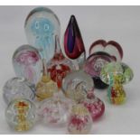 A collection of 20th century coloured glass paperweights