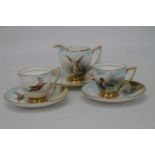 A Minton part tea set to include two teacups and saucers, milk jug and one other side plate, each