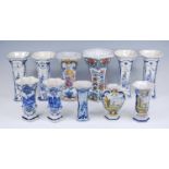 A set of four Nederlansche Keramische Industrie blue and white trumpet vases, 20th century, h.24.