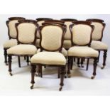 A set of eight Victorian mahogany dining chairs, each having recently reupholstered waisted backs
