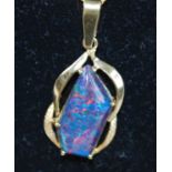 A yellow metal abstract opal doublet pendant, comprising an approx 22 x 10mm black opal doublet claw