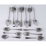 Seven various 18th century and later silver table spoons, in the Hanoverian pattern, all with