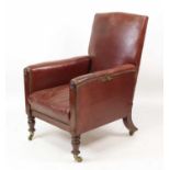 An early Victorian mahogany framed and brown leather upholstered armchair, having reclining action