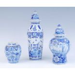 A Delft blue and white vase and cover, 18th century, of fluted octagonal form, decorated with