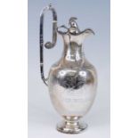 A Victorian silver 'Roman Revival' coffee pot, of amphora form with high-set engraved handle with