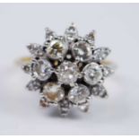 A yellow and white metal diamond flower shaped cluster ring, comprising a centre Old European cut