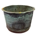 A circa 1900 large copper log bucket of circular form with riveted construction, verdigris patina,