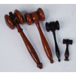 An early 20th century mahogany auctioneers gavel, of typical form, 17cm, together with three