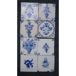 A Dutch blue and white tile, circa 1600-50, decorated with flowers, 13 x 13cm, together with seven