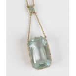 A 9ct gold and aquamarine pendant on finelink neck chain, the octagon cut aquamarine measuring