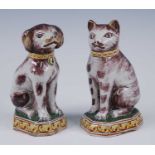 A pair of Royal Tichelaar Makkum Delft polychrome models of animals, circa 1900, each shown in