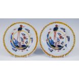 A pair of London polychrome delftware plates, probably Norfolk House, circa 1730, each decorated