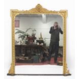 A late Victorian giltwood and gesso overmantel mirror, having a raised frieze and ebonised plinth,