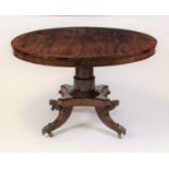 A Regency rosewood pedestal breakfast table, the circular cross banded tilt top on a heavy gun