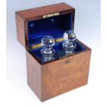 A Victorian figured walnut and brass bound decanter box, the velvet lined fitted interior housing