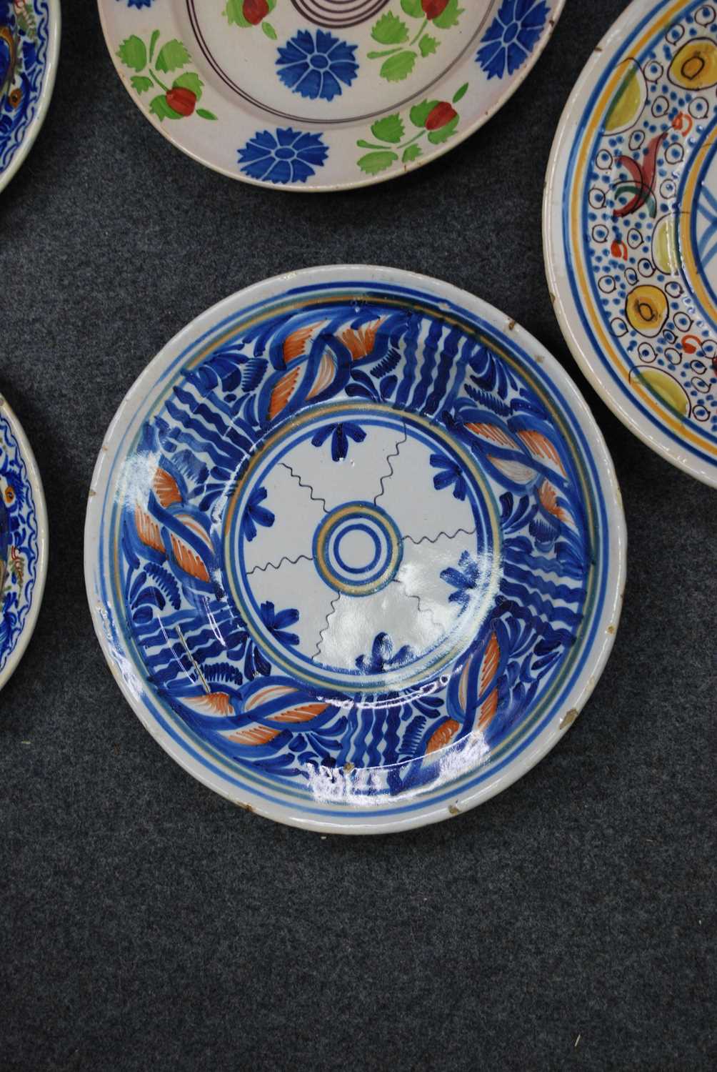 A collection of five Spanish polychrome glazed earthenware dishes, to inlcude Manises examples, 19th - Image 4 of 7