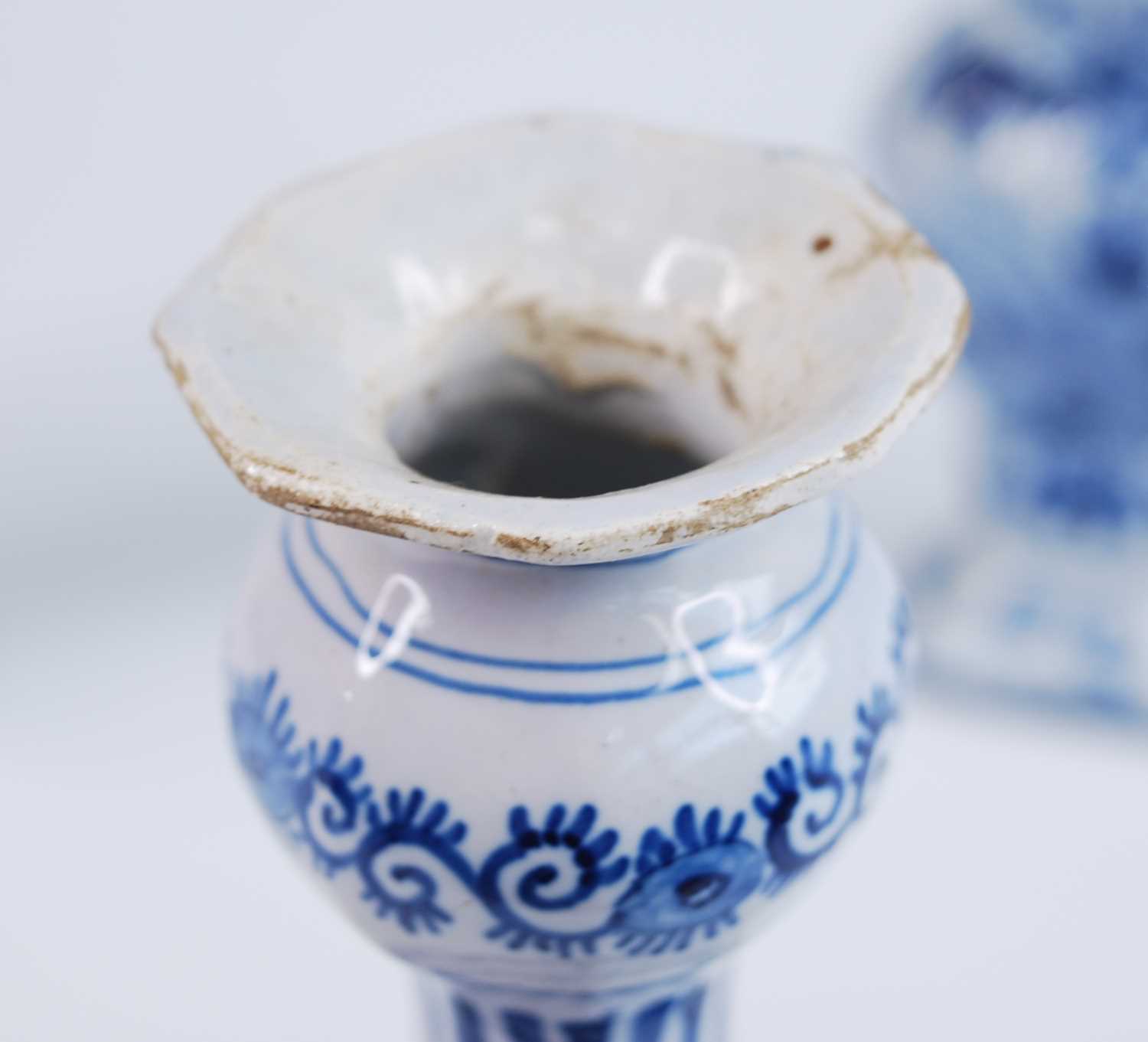 A Delft blue and white vase, 18th century, the garlic neck above a globular body, decorated with - Image 6 of 9
