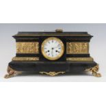 A late Victorian polished black slate and gilt metal mounted mantel clock, having an unsigned
