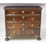 A Jacobean period oak chest of four long geometric moulded drawers, having engraved brass