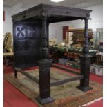 A mid-17th century and later oak full tester double bedstead, the canopy blind carved with nine