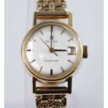 An 18ct yellow gold Omega Ladymatic wristwatch, having a 20mm round cream baton dial and date at 3