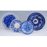 A Spanish Manises blue and white plate, 19th century, decorated with a pagoda, dia.22cm, together