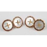 A pair of yellow metal double-ended cufflinks, each having two 15mm circular plates with mother of