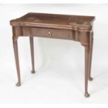 An early George III mahogany card table, the fold-over top with proud and dished corners, and