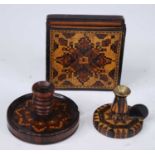 A Victorian rosewood Tunbridge ware miniature chamberstick, having a tuned sconce on a circular
