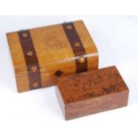 A Victorian oak and rosewood banded work box, the hinged domed lid with raised roundels opening to
