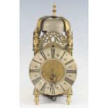 A brass lantern clock, the 6½" silvered Roman dial with inner quarter track and half-hour divisions,