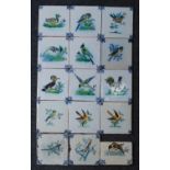 A matched set of fifteen Dutch polychrome tiles, 17th century style, each decorated with a bird