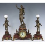 An early 20th century French bronzed metal and marble three-piece clock garniture, the